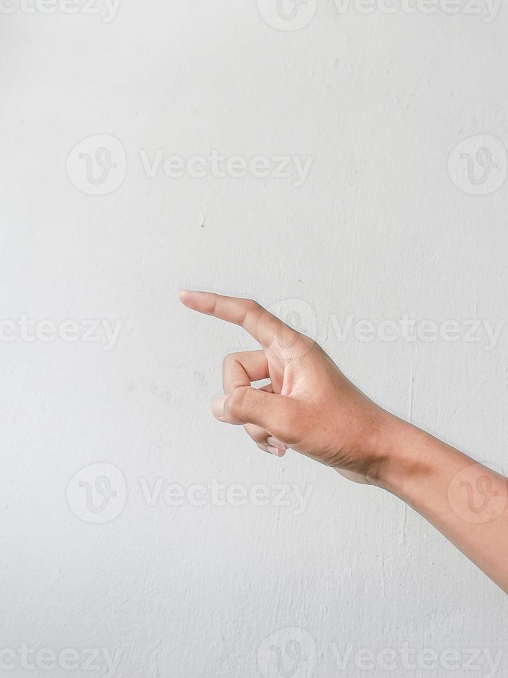 Close-up of hands showing gestures on textured background. photo