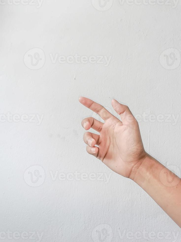 Close-up of hands showing gestures on textured background. photo