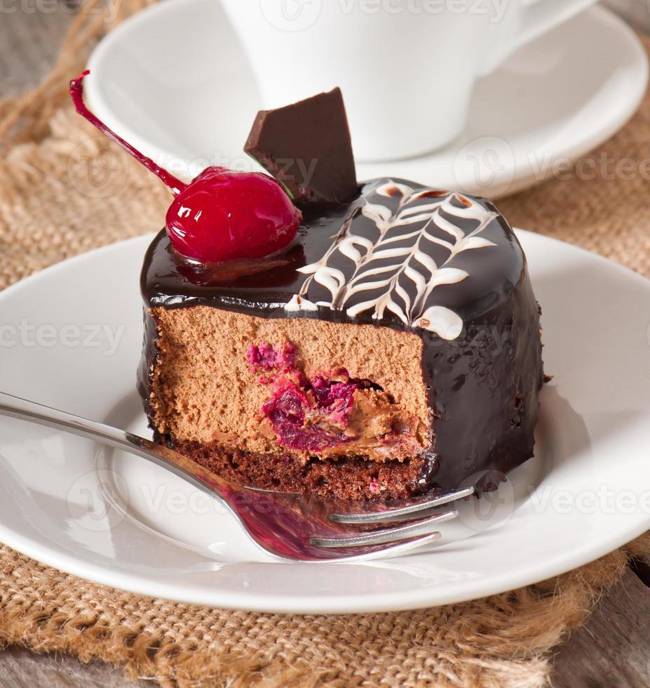 Sweet dessert fruitcake with a cherry photo