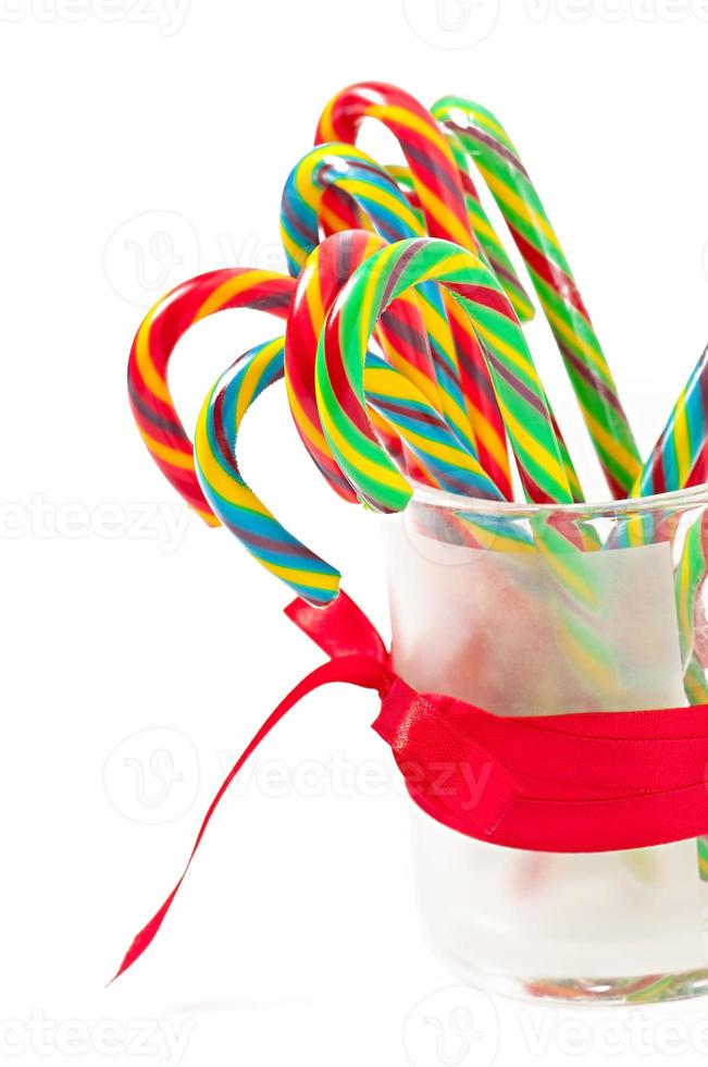Christmas candy canes on white background photo