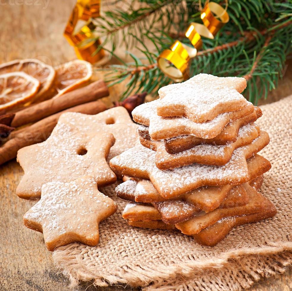 Homemade Christmas cookies sprinkled with powdered sugar photo