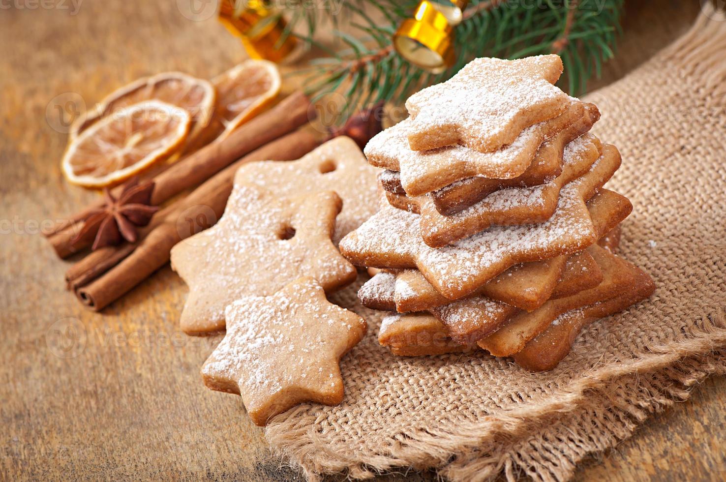 Homemade Christmas cookies sprinkled with powdered sugar photo