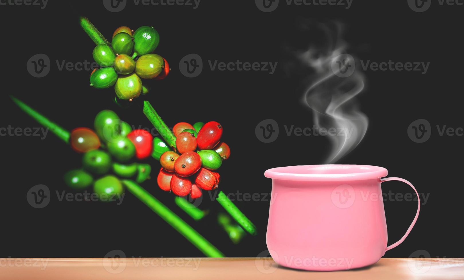 A bright pink metallic coffee cup on vacation. photo