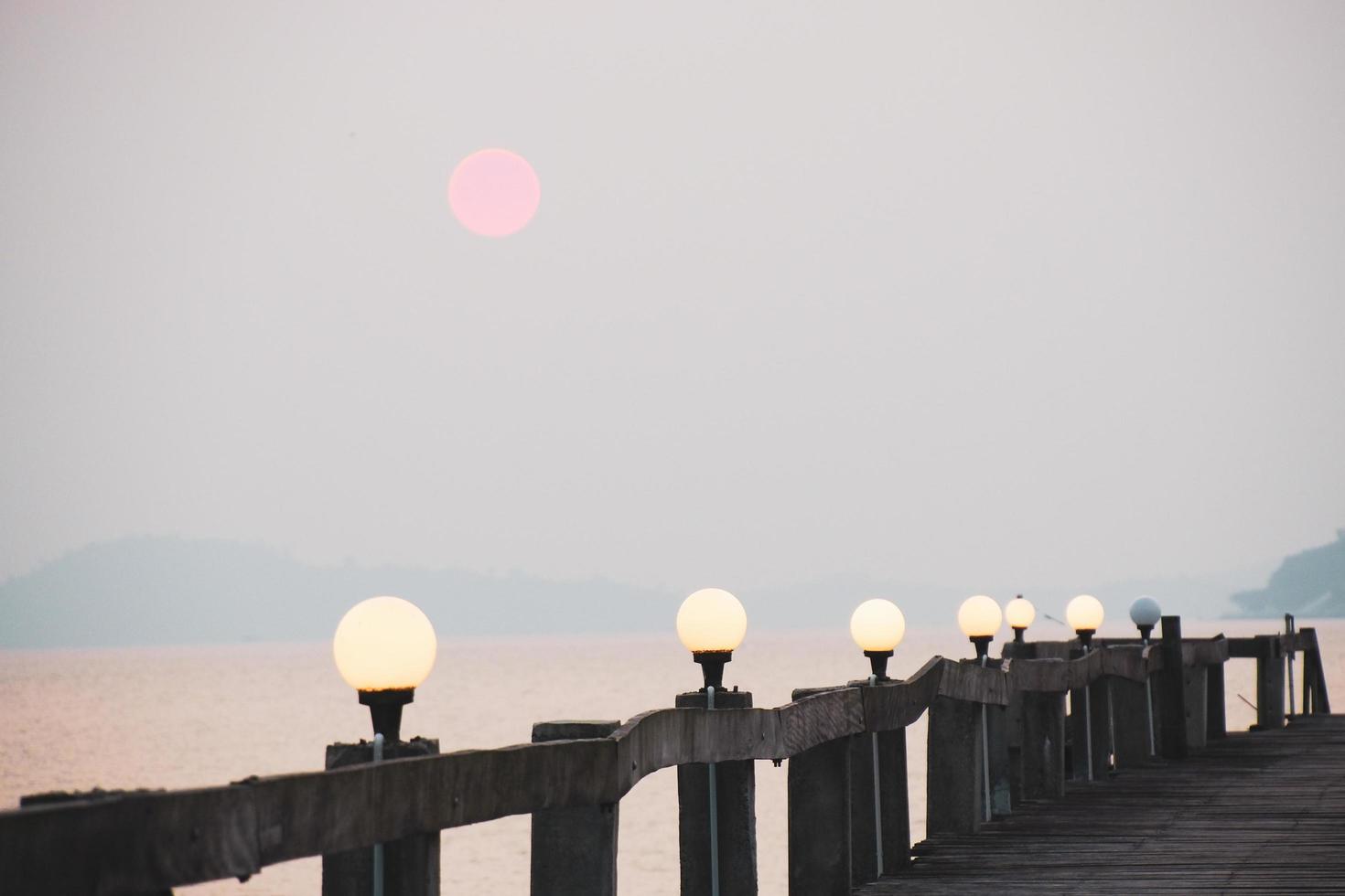 A wooden walkway that stretches into the sea. vacation travel concept photo