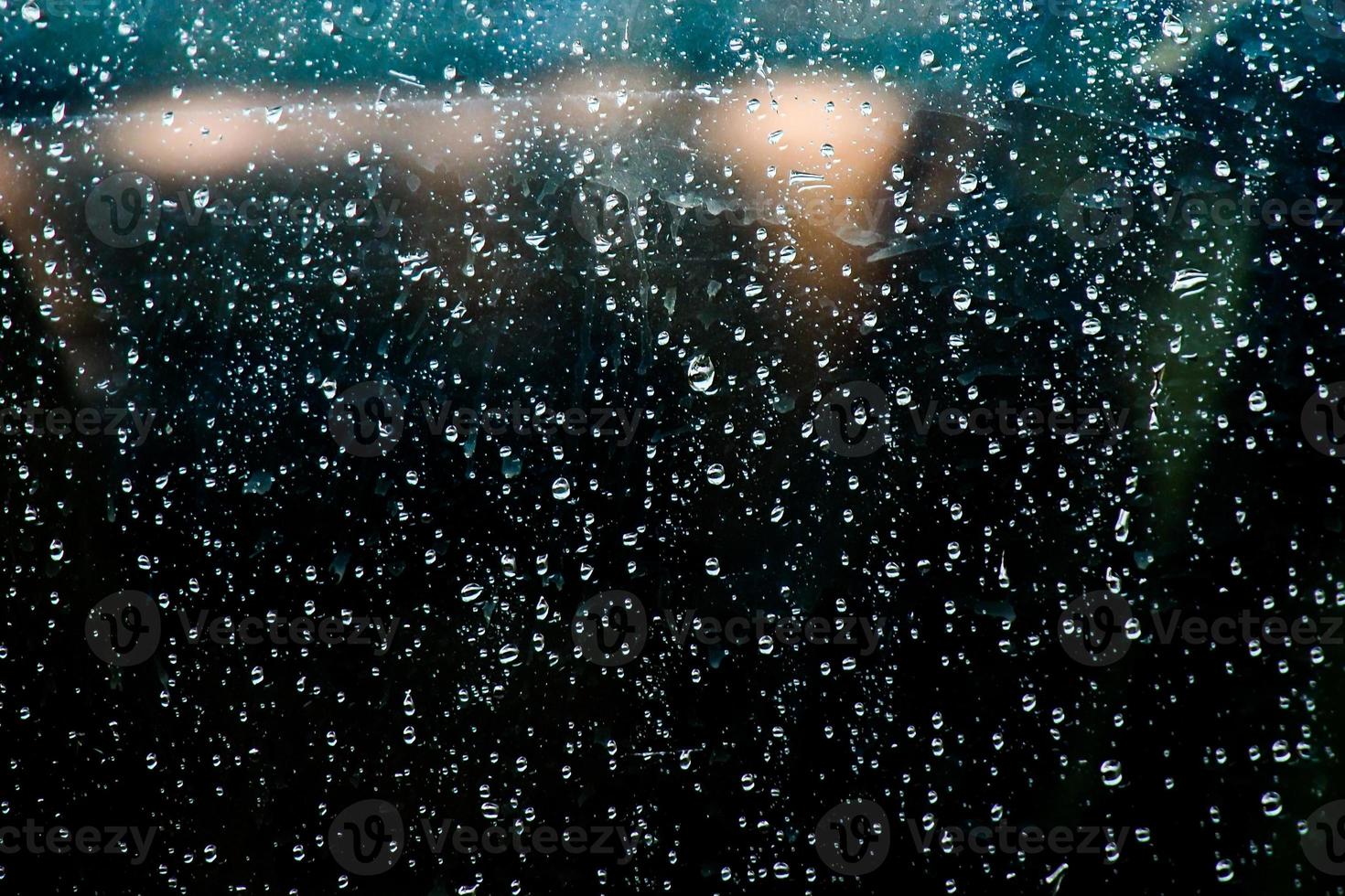 abstract background of water droplets stuck on glass photo