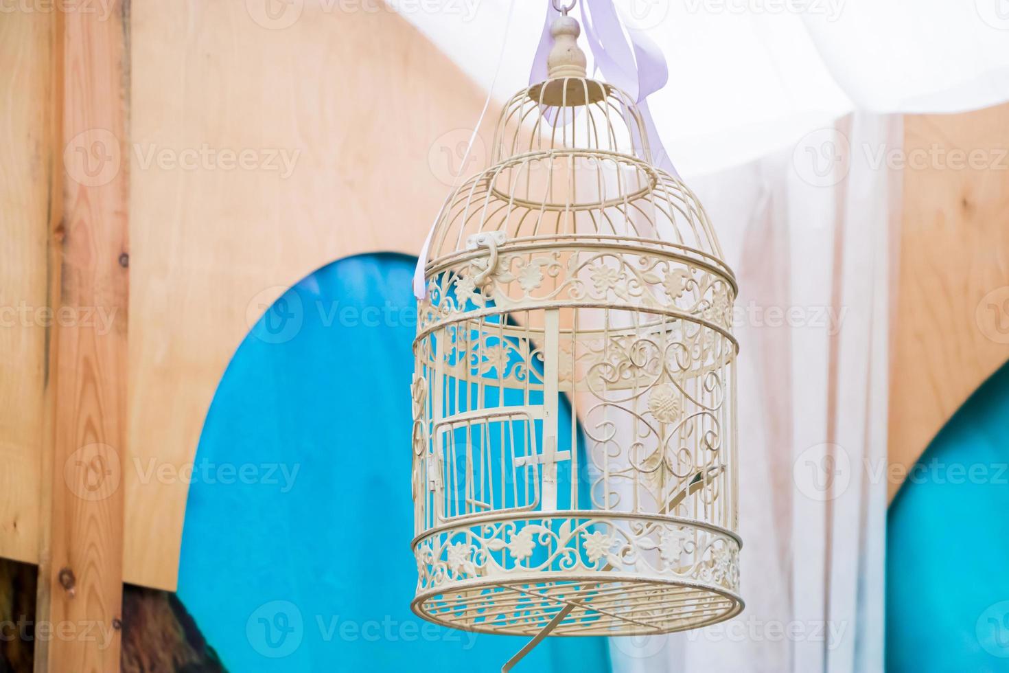 Vintage empty white bird cage. Home stylish decor. photo