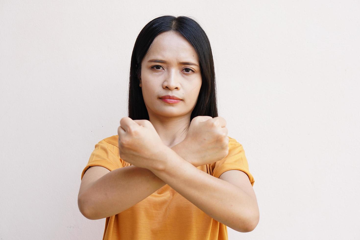 Asian women mark hands in crosses. photo