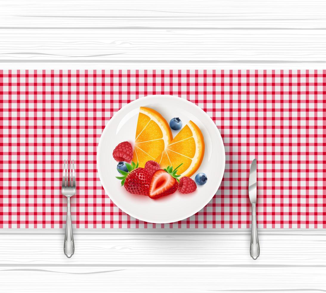 Fresh fruit salad in white saucer with fork and knife on wooden table vector