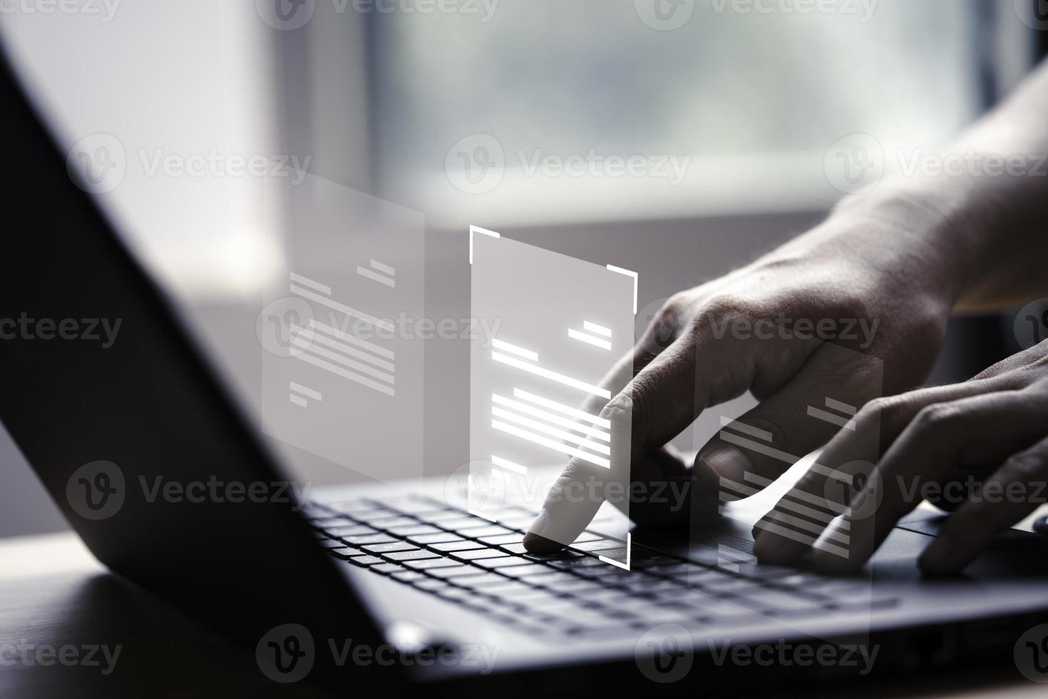 Hand using laptop computer with virtual screen and document for online approve paperless quality assurance and ERP management concept. photo