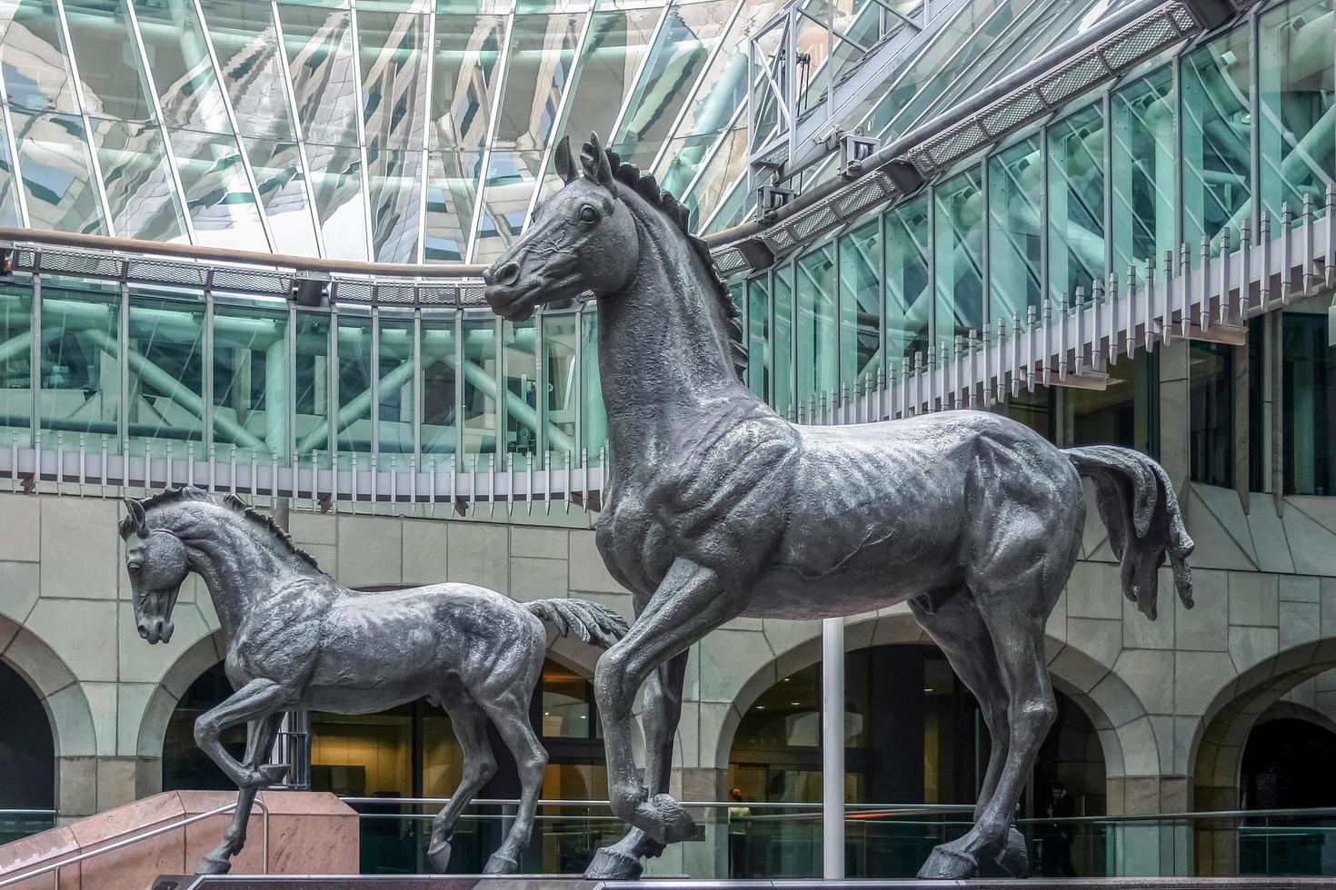 London, UK, 2004. Statues of Two Magnificent Horses at Minster Court photo