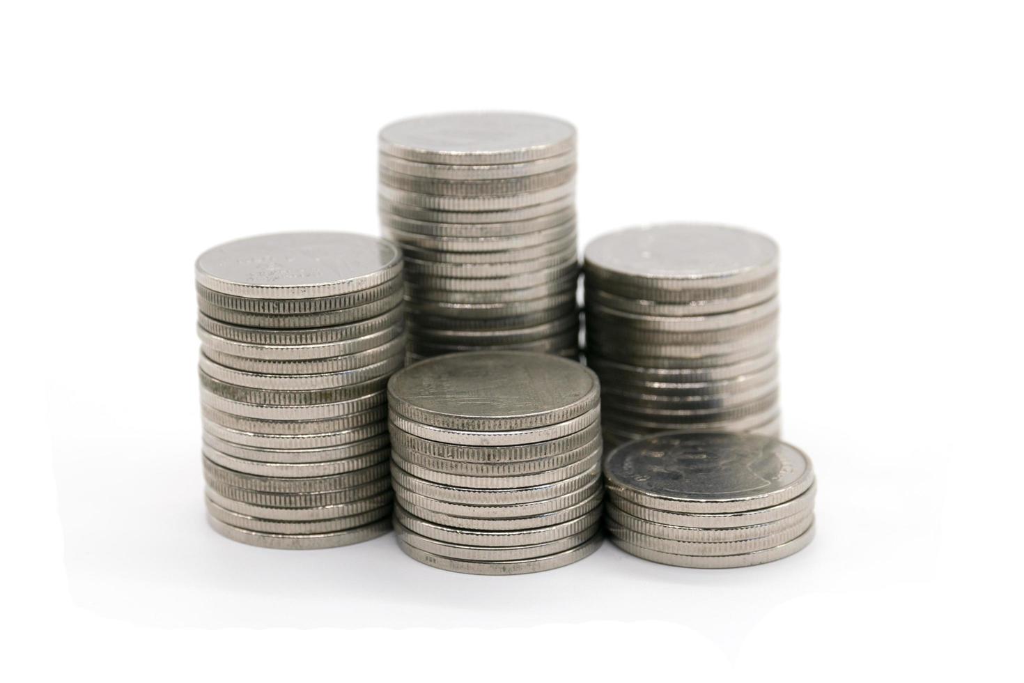 coins stacked on white background photo