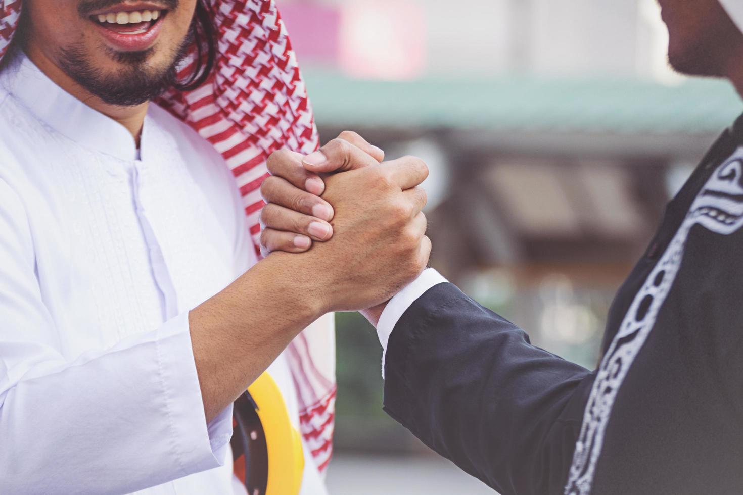 Arab businessmen worker handshaking on construction site photo