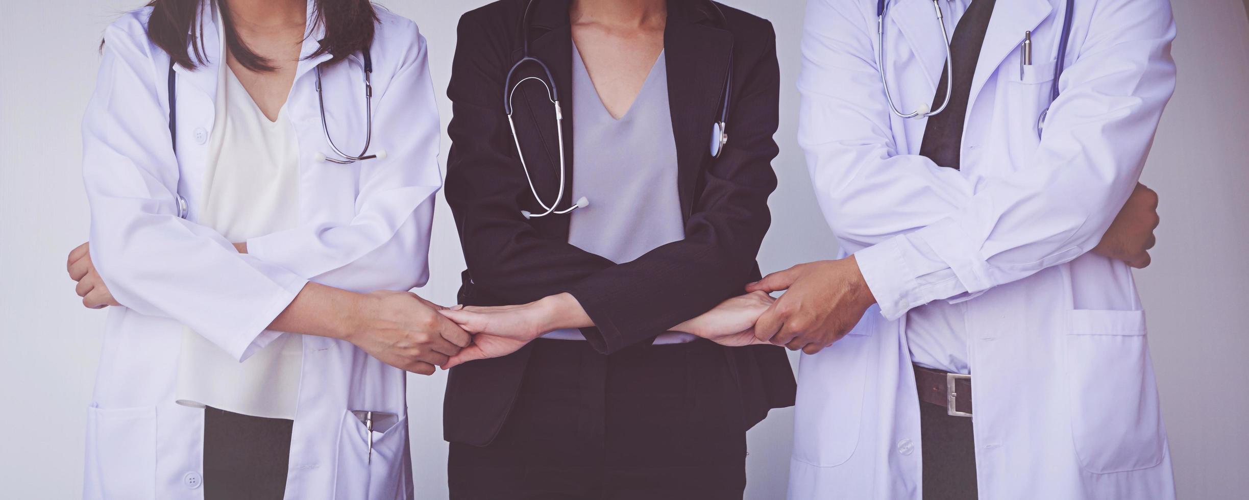 Doctors and Nurses coordinate hands. Concept Teamwork photo