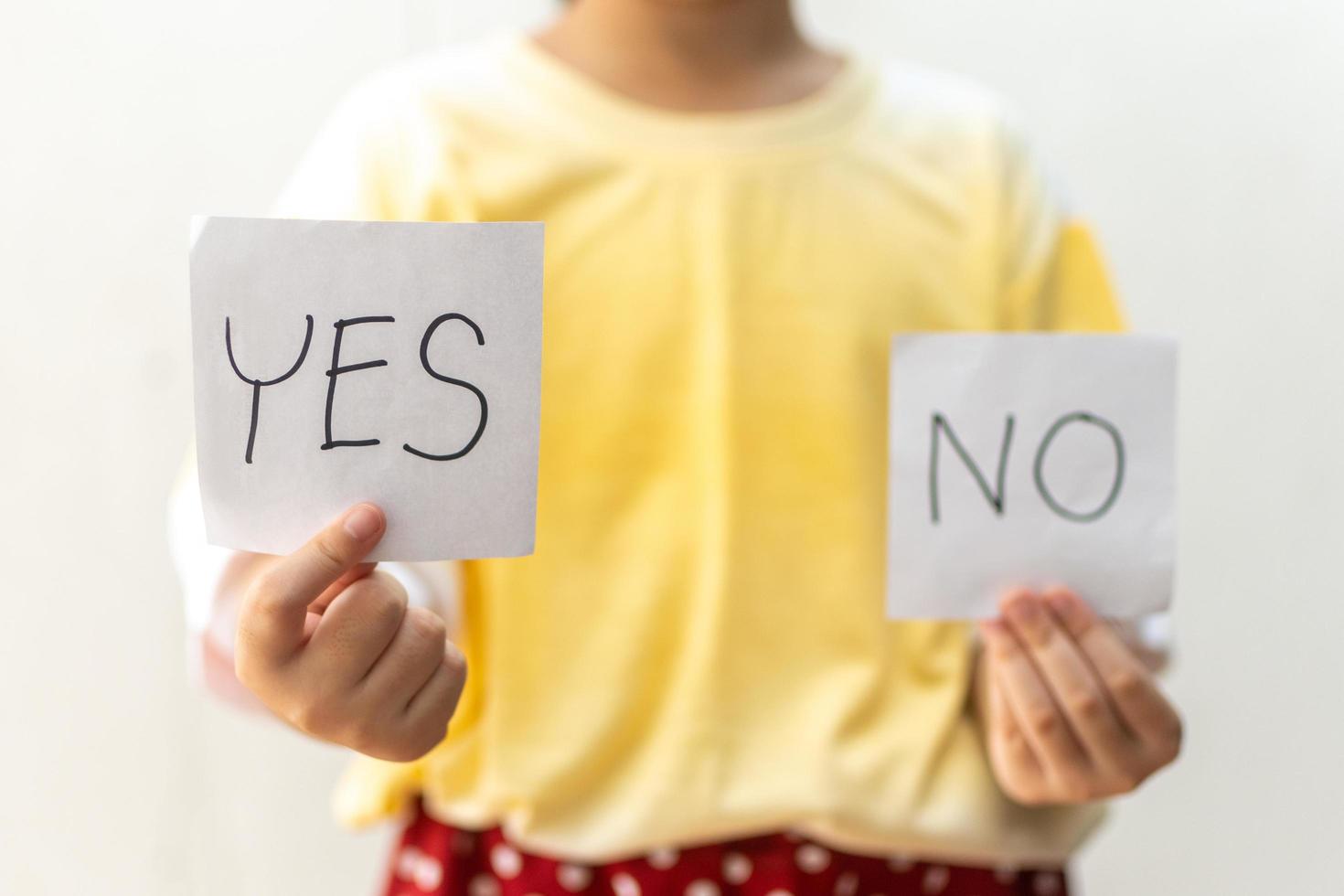 Girl trying to make a decision between Yes or No choice photo