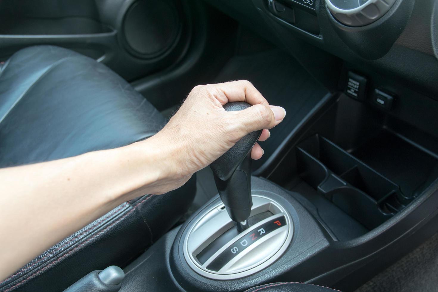 hand on automatic gear shift photo