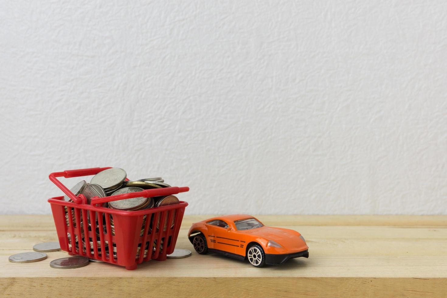 Basket red with car and coins for money concept photo