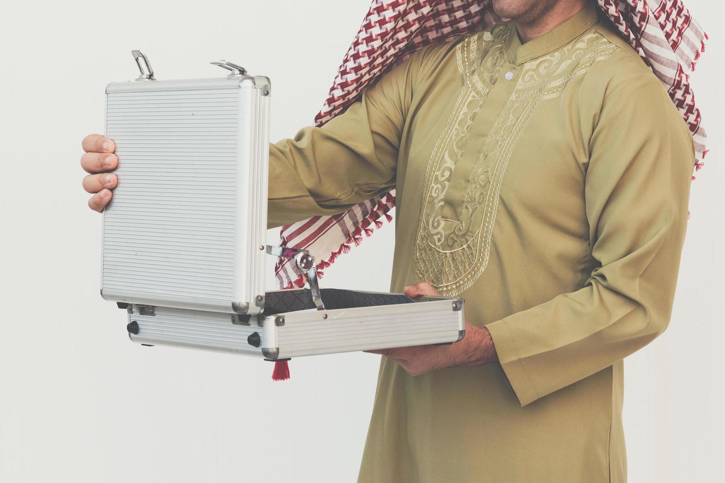 Arab businessman opening suitcase photo