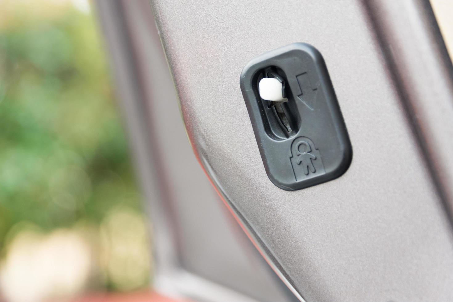 lock button to prevent children from opening doors photo
