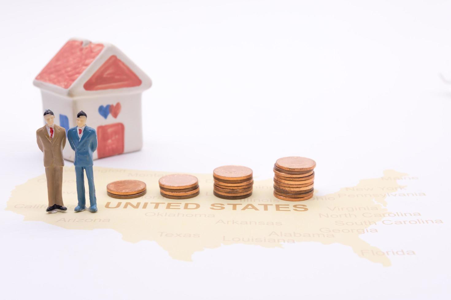 Businessman and house on map American. Miniature people photo