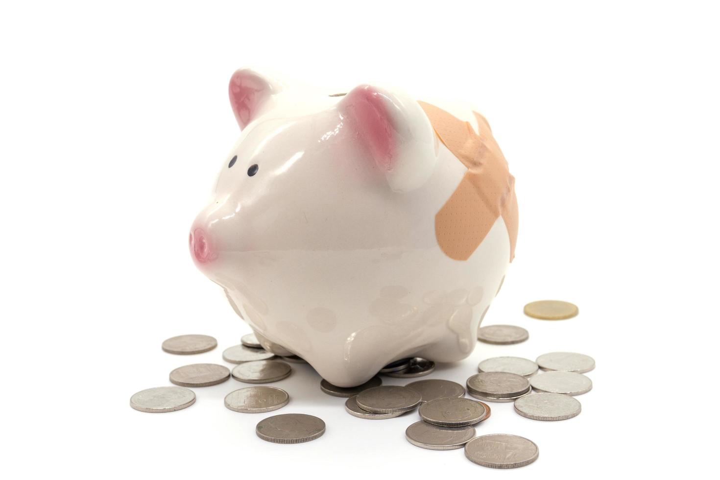 stethoscope with pink piggy bank and coins photo