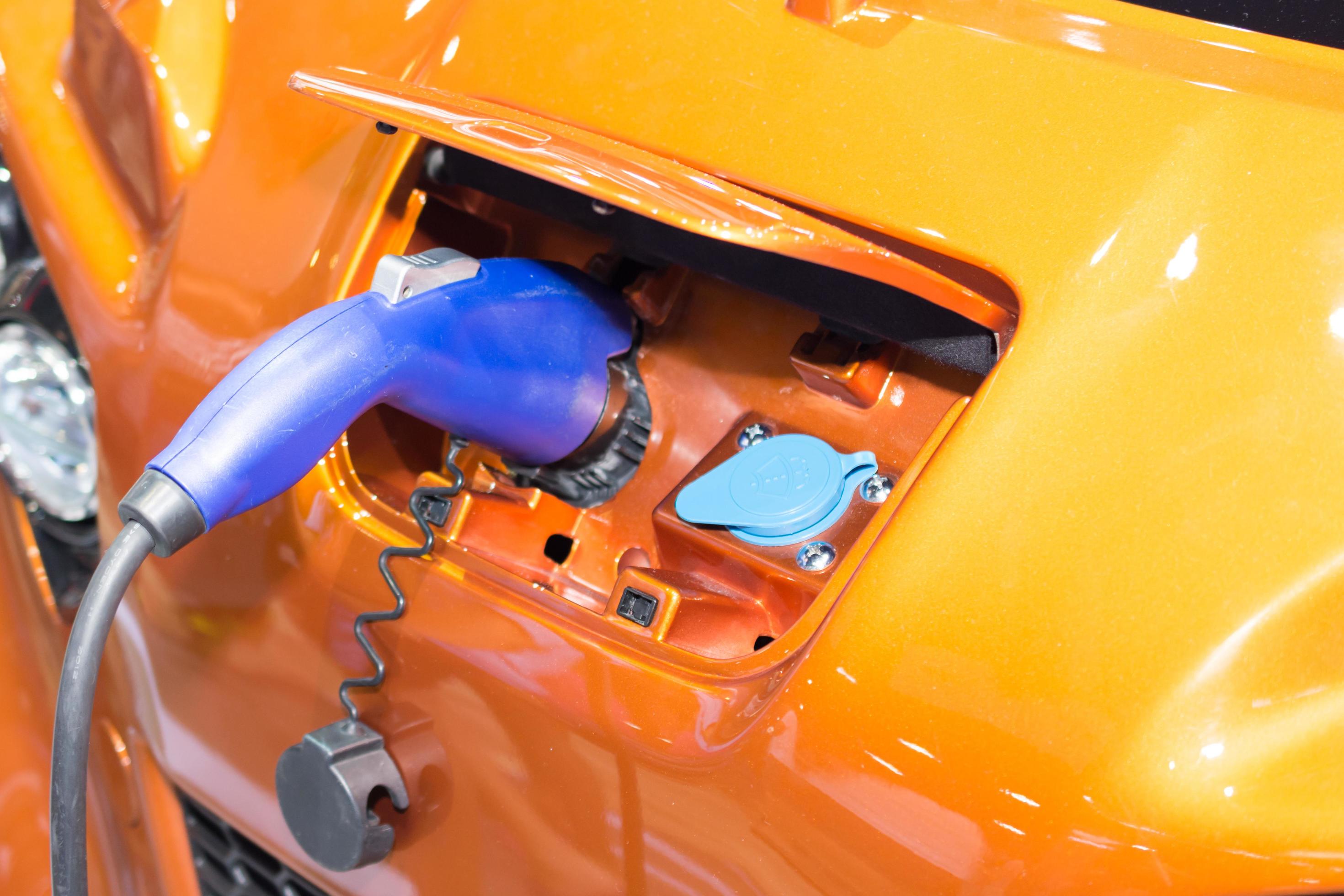 Charging an electric car battery 7183007 Stock Photo at Vecteezy
