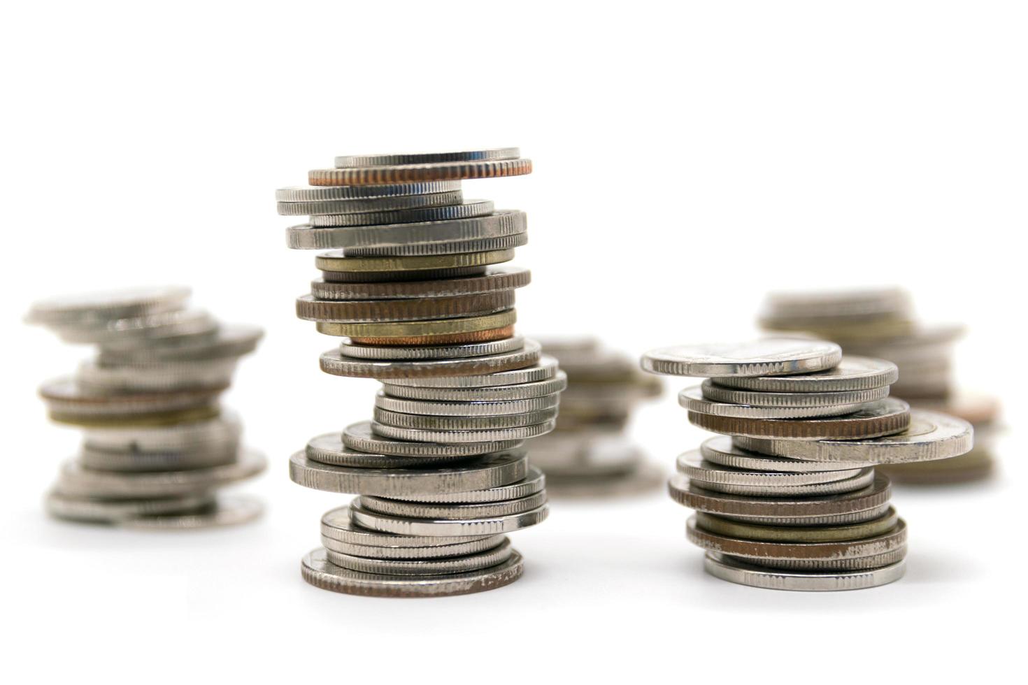 coins stacked on white background photo