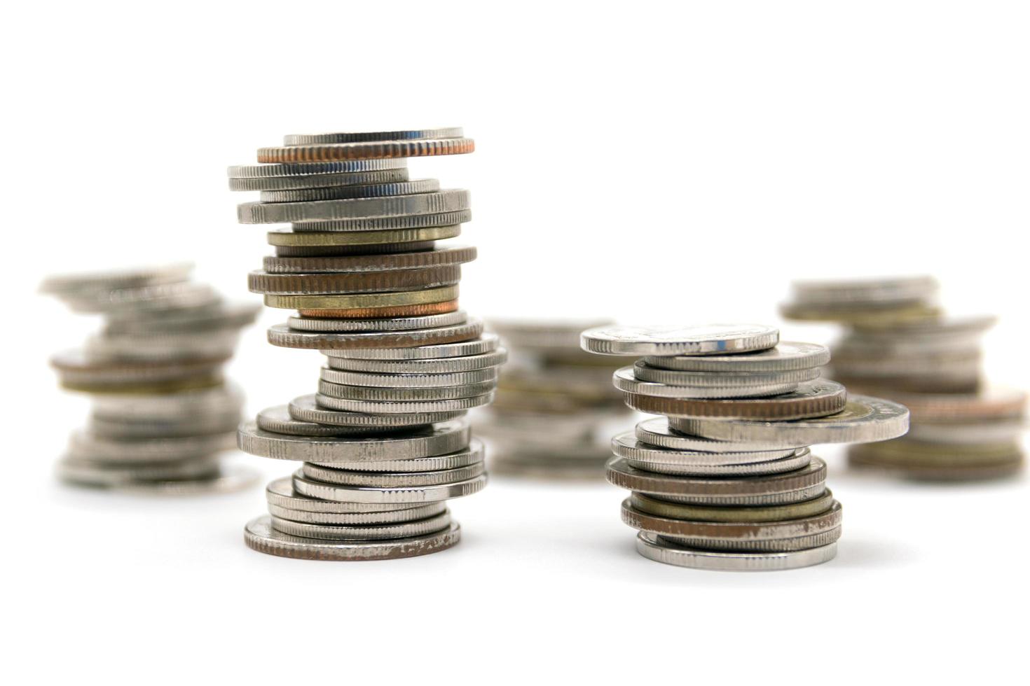 coins stacked on white background photo