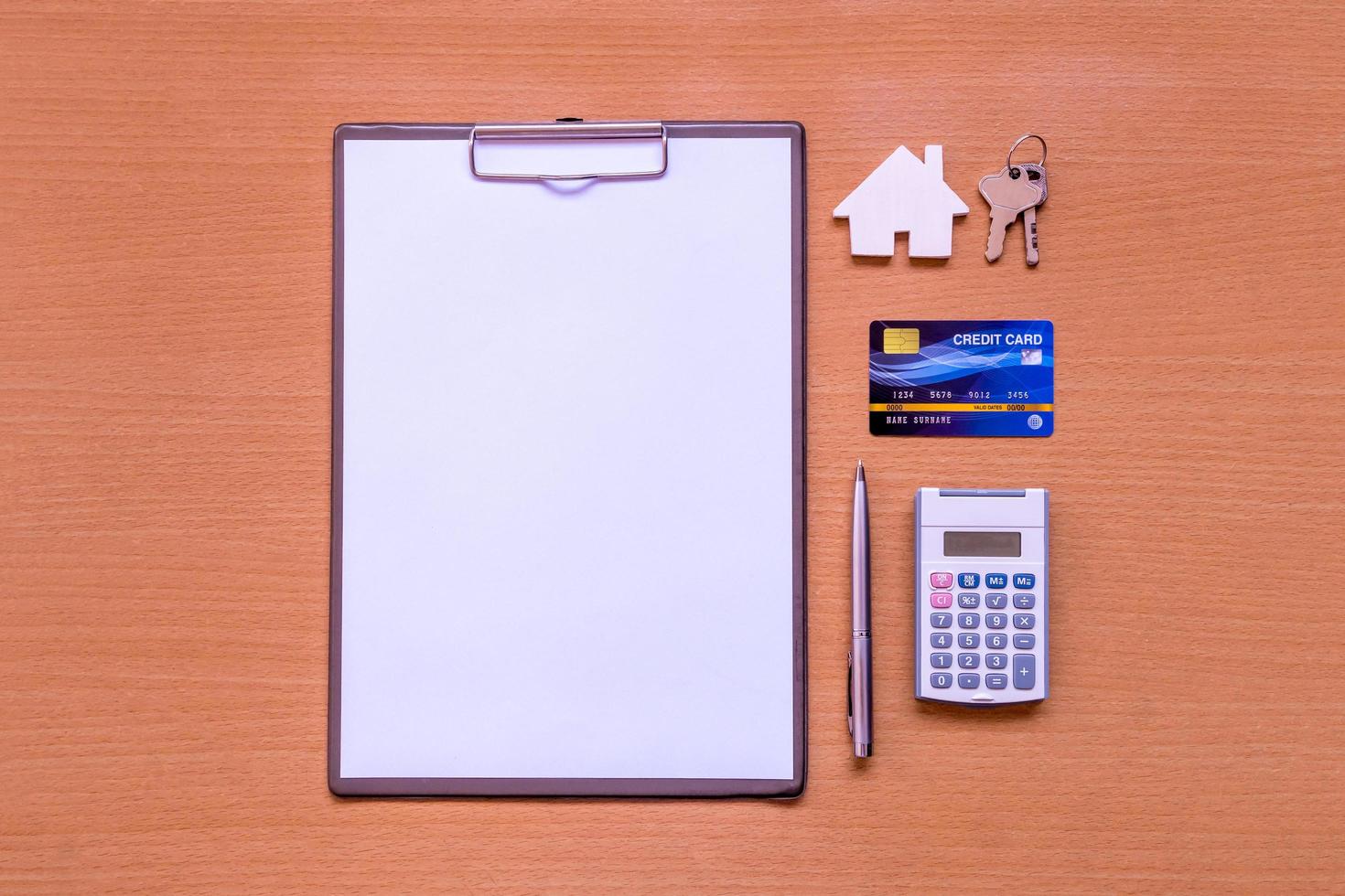 White paper house form with model and policy document photo