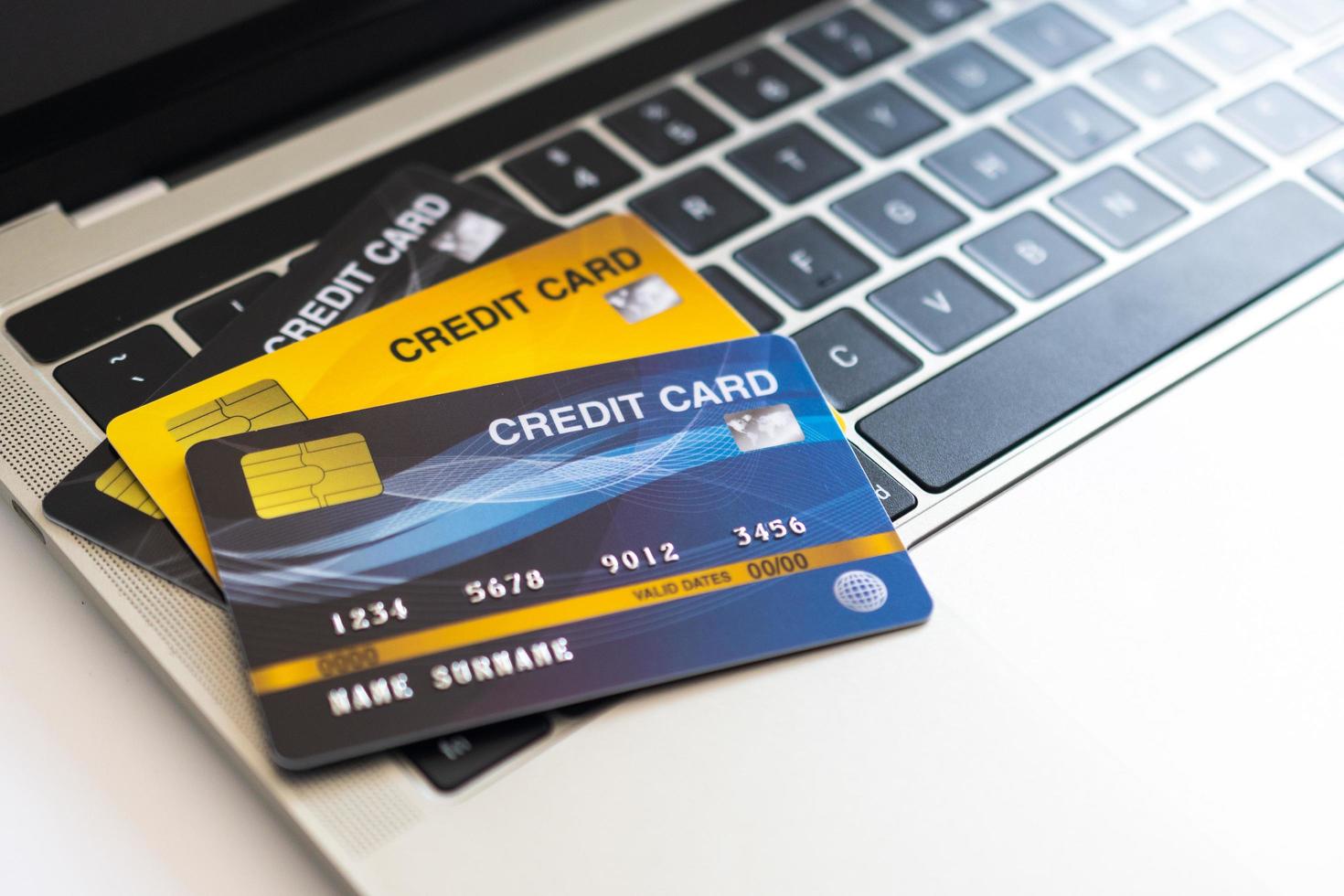 Credit card on a computer keyboard. internet purchase concept photo