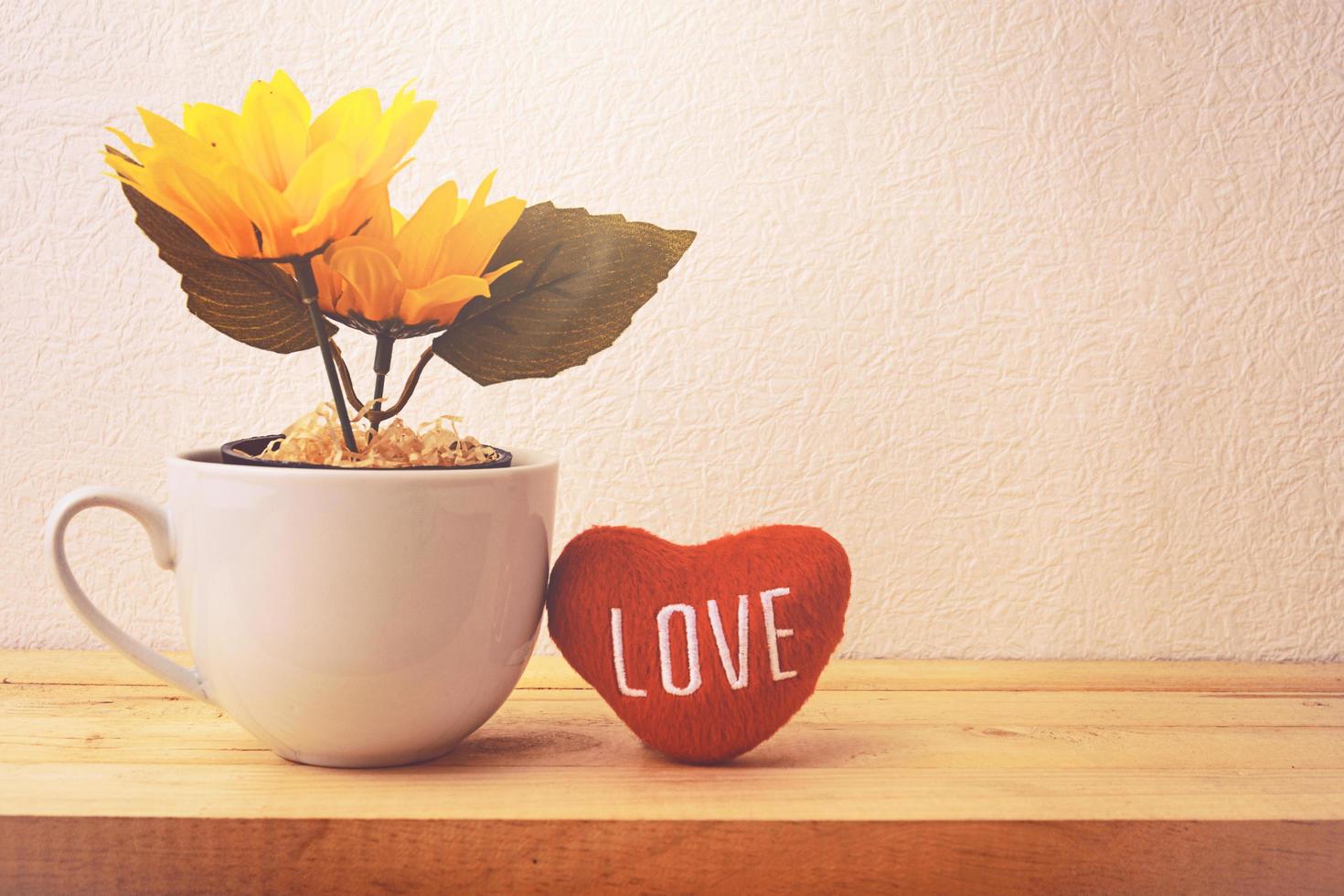 Sunflower in a white cup photo