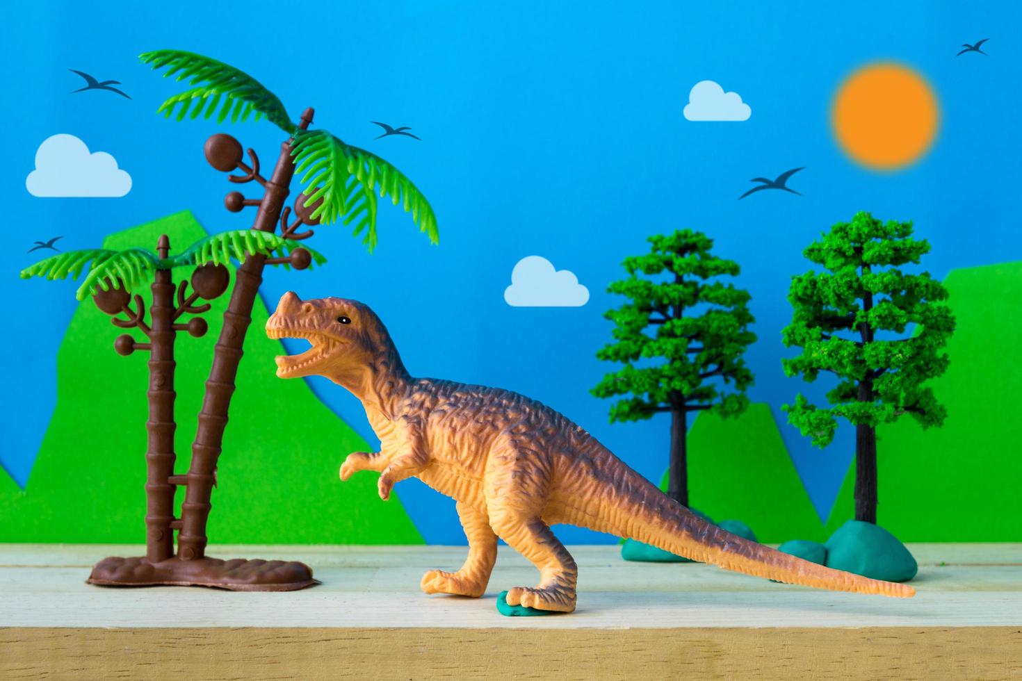Tyrannosaurus dinosaur toy model on wild models background photo