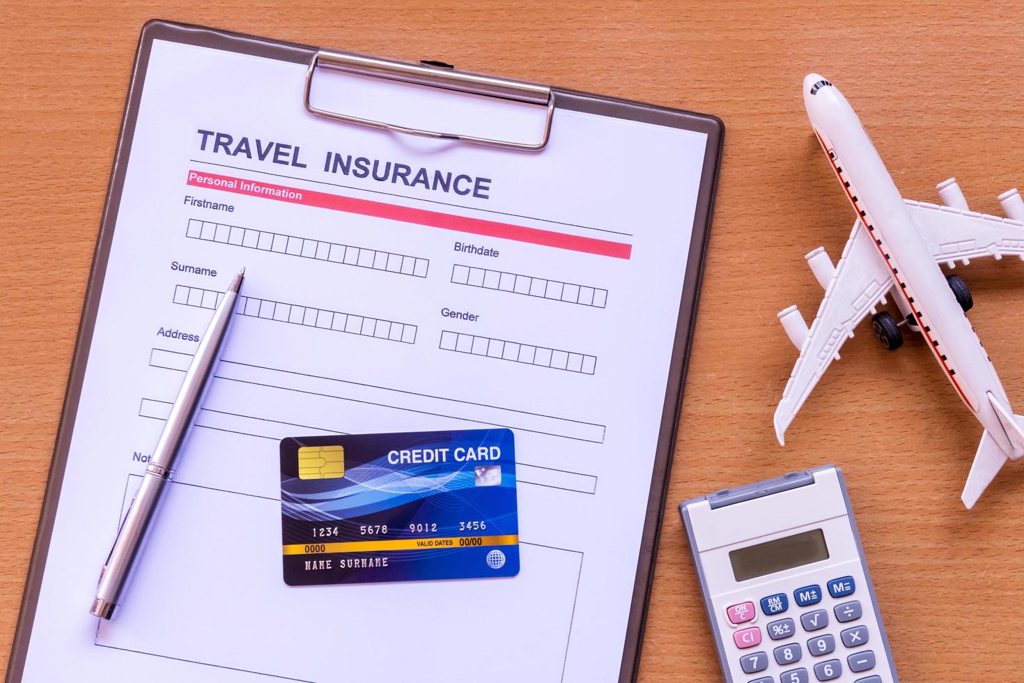 Travel  insurance form with model and policy document photo