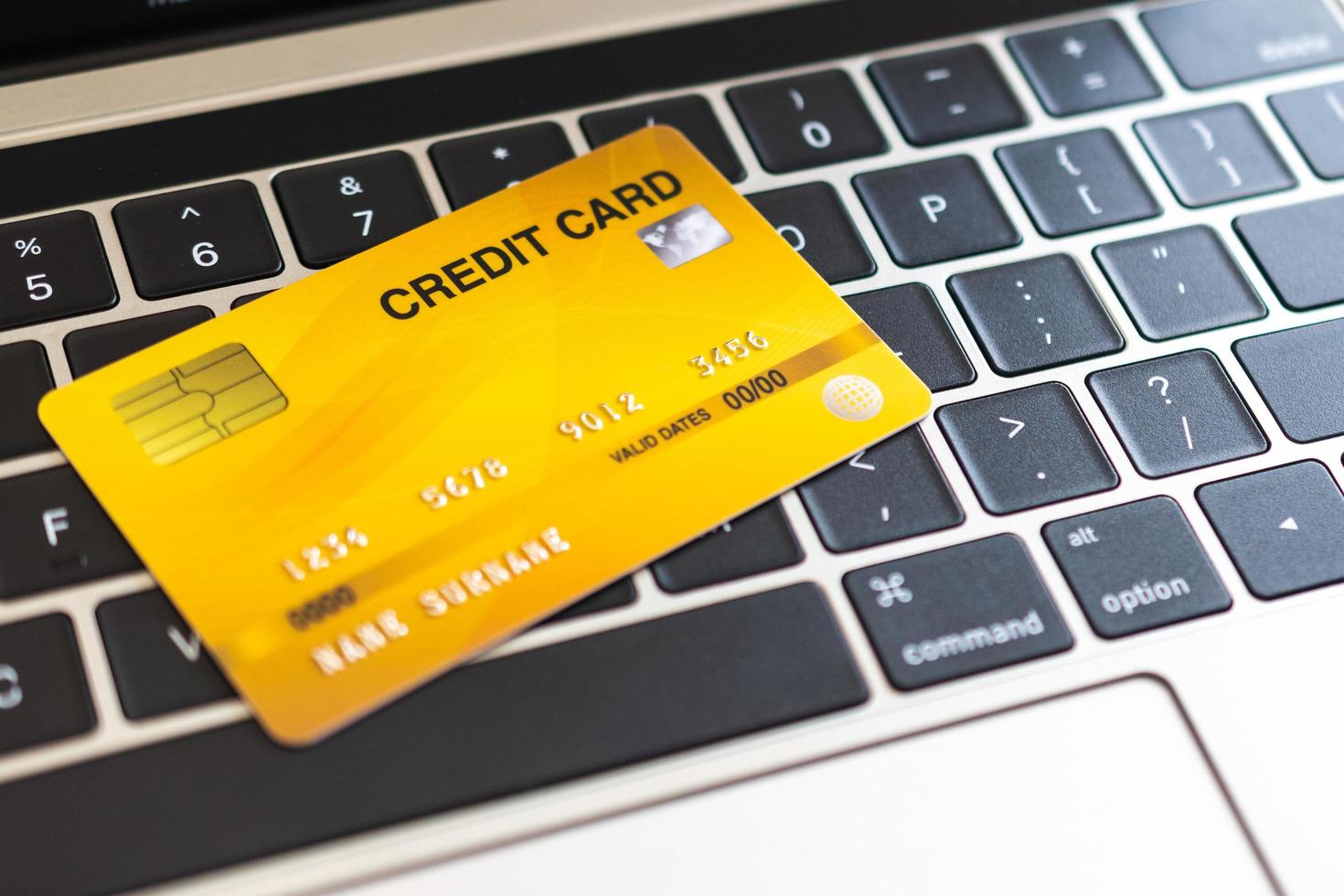 Credit card on a computer keyboard. internet purchase concept photo