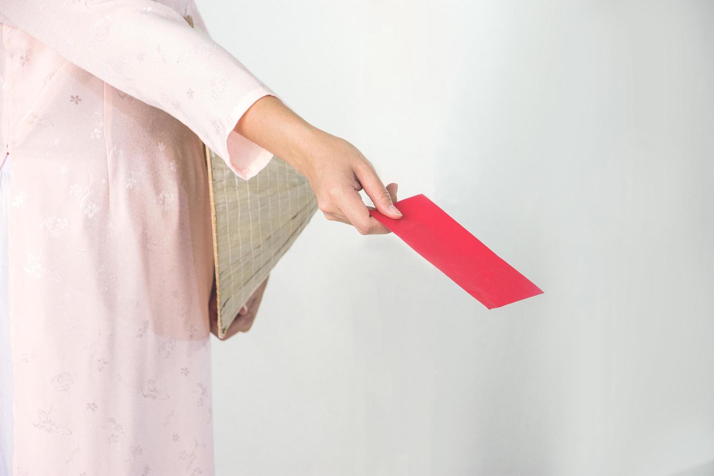 Vietnam woman holding red envelope, woman wear Vietnamese, Vietnamese new year photo