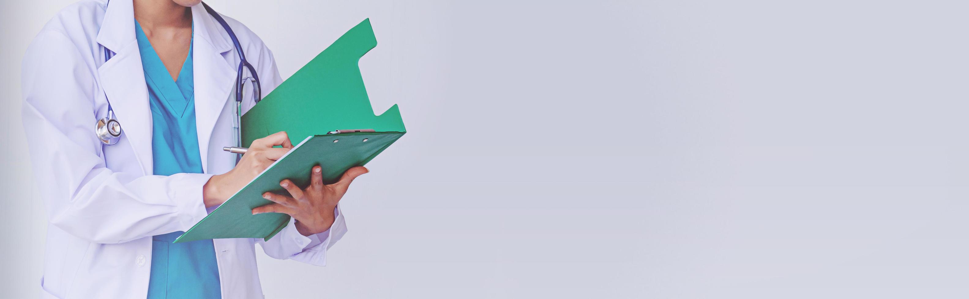 Doctor holding a clipboard with prescription photo
