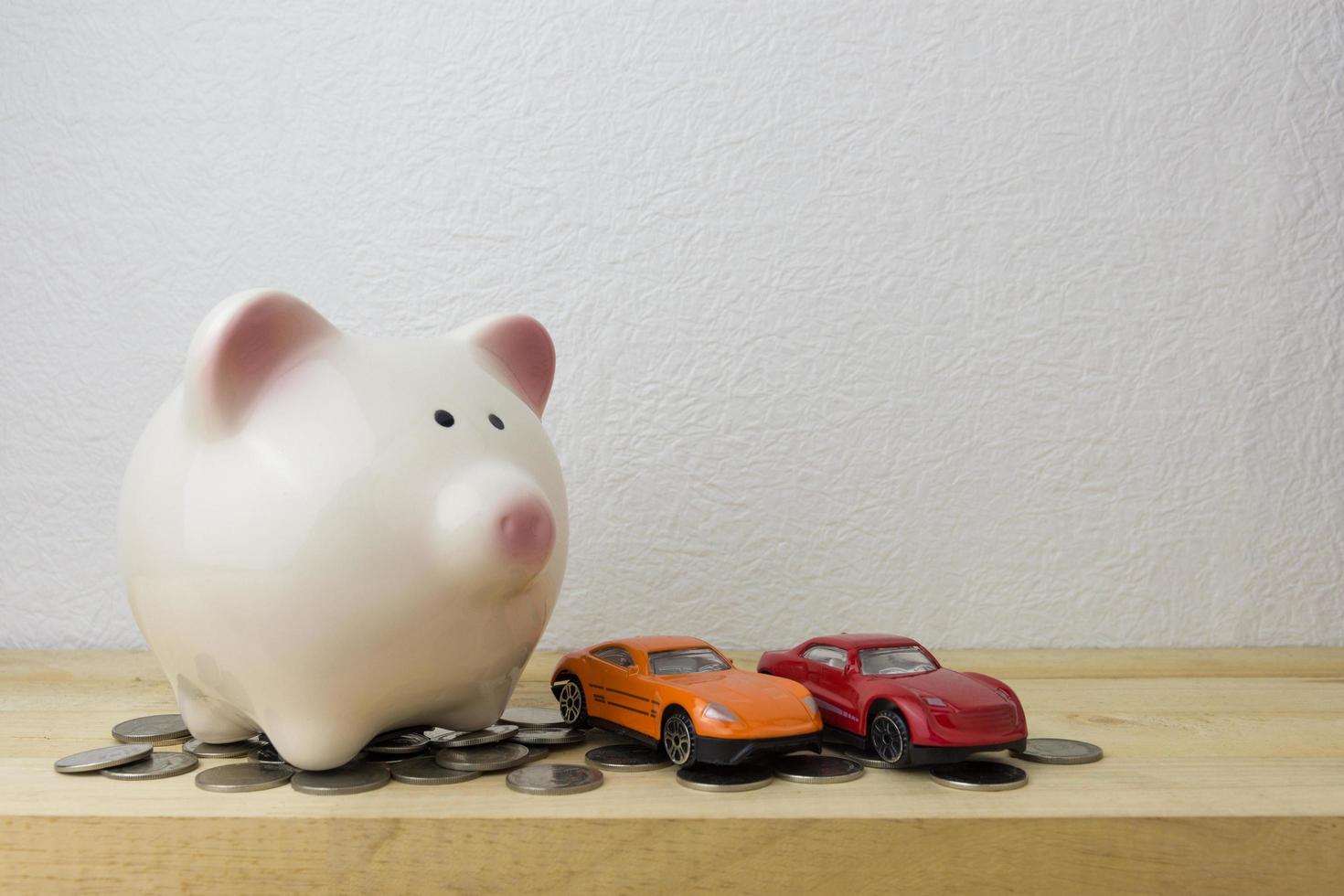 piggy bank with car and coins photo