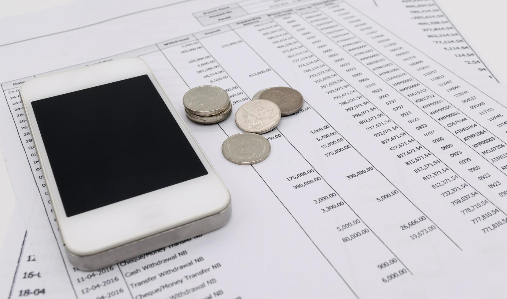 Mobile smart phone and money bank statement, finance concept photo