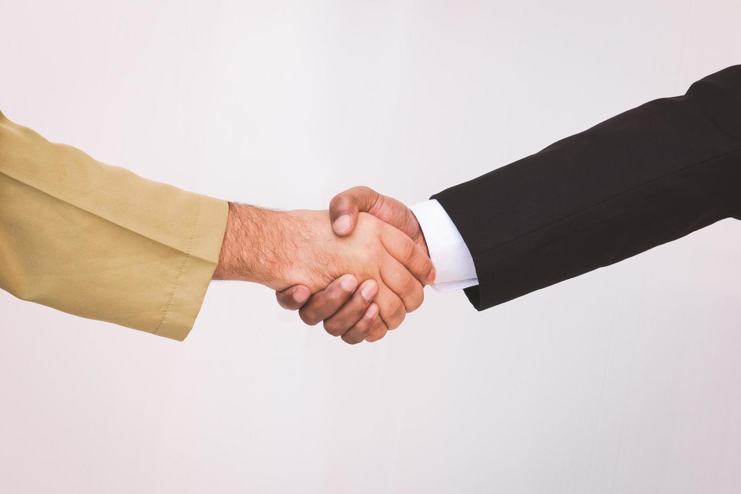 Arab businessman and businessman worker handshaking photo