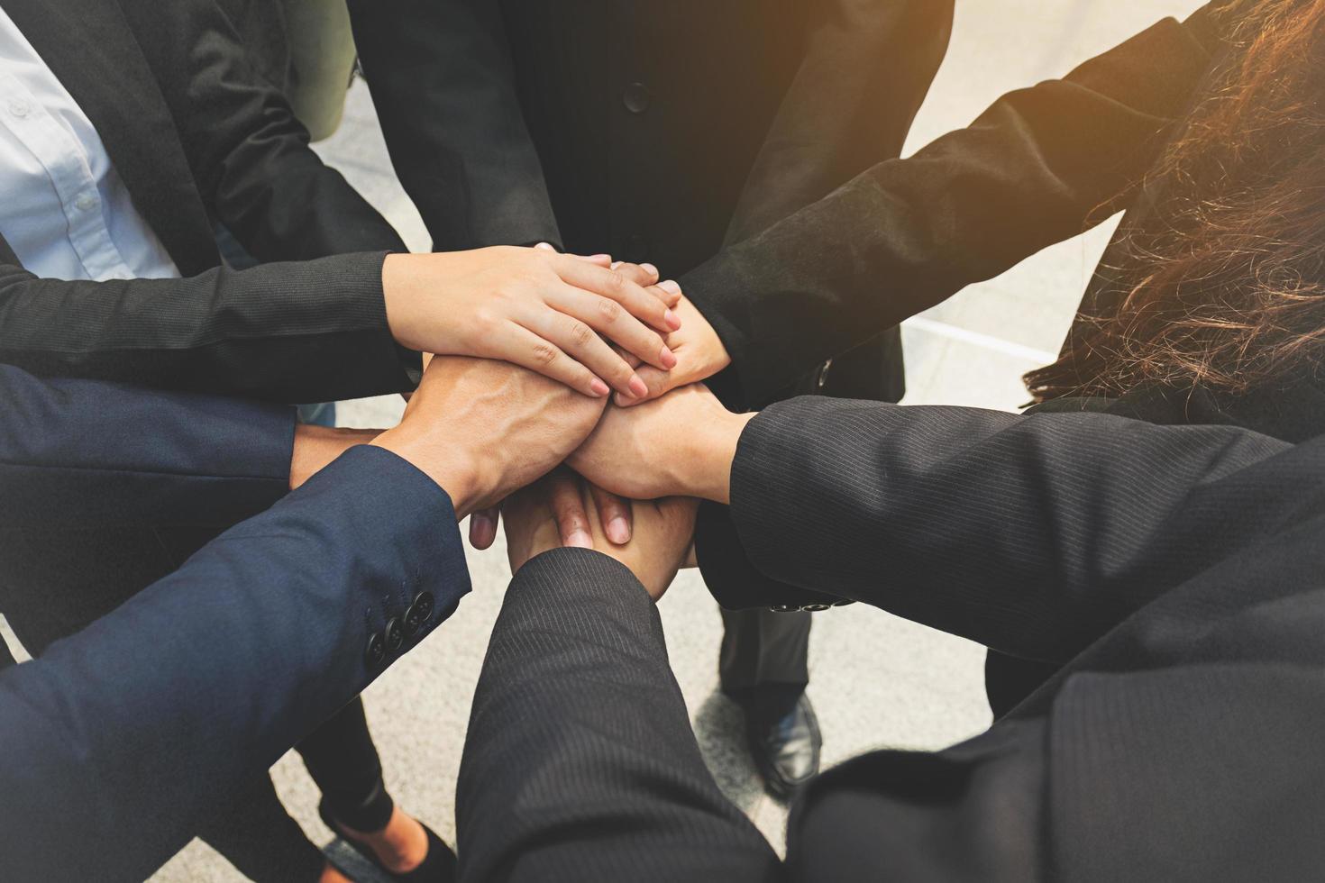 Group of business people joining hands. Team work concept. photo