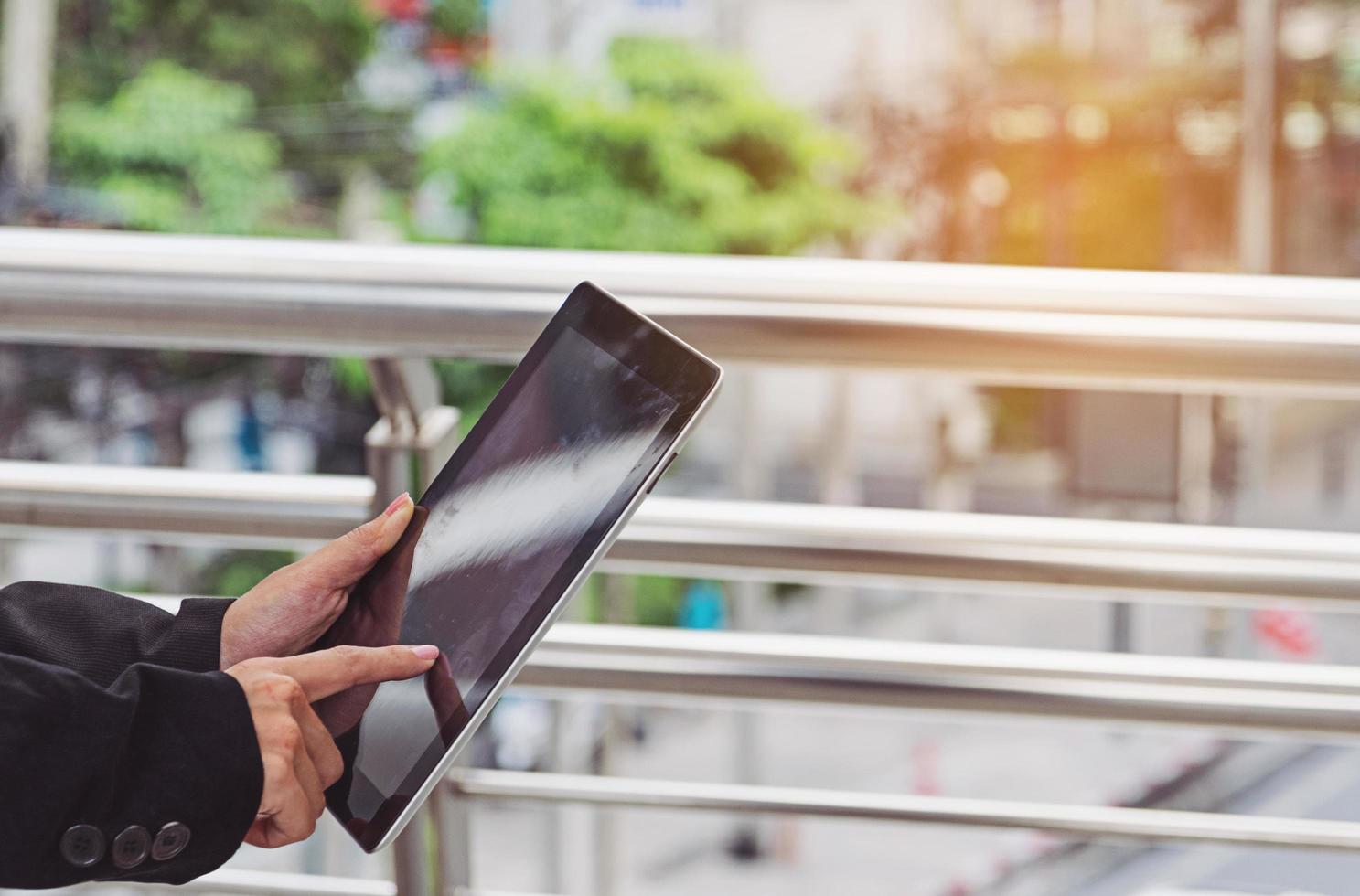 young businesswoman using digital tablet photo