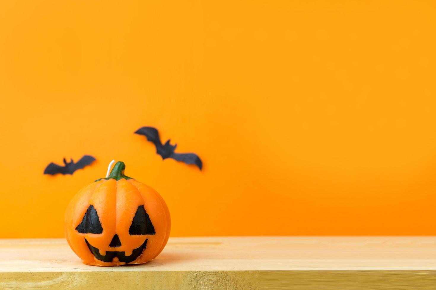 Halloween Pumpkins on wooden table photo