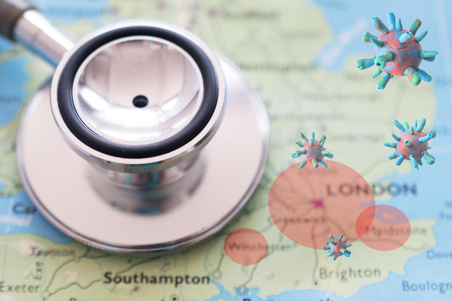 Stethoscope on London map background. outbreak of the virus covid-19 in London red zone photo