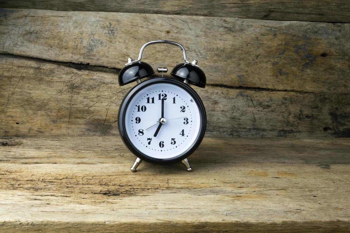 Morning alarm clock on table photo