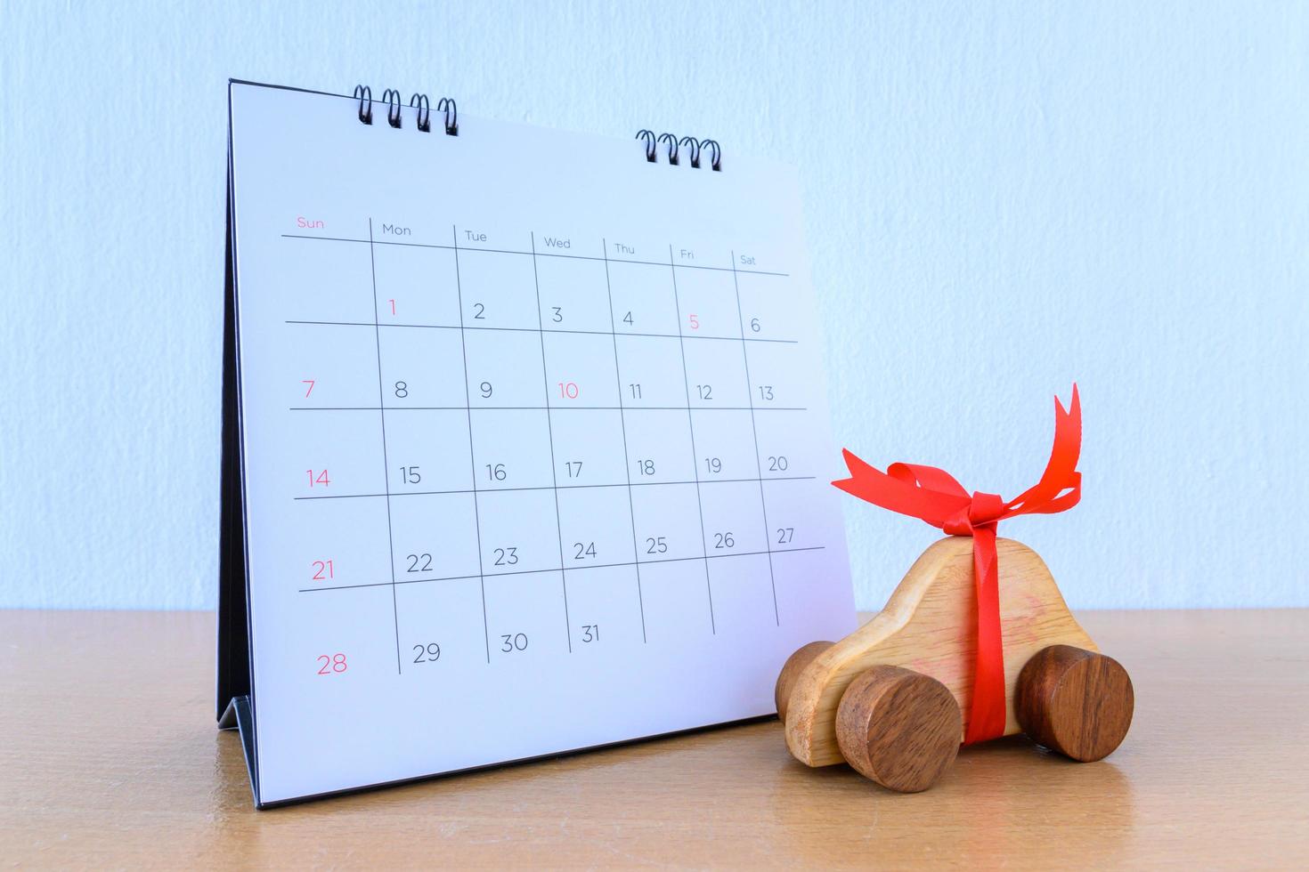 Car with ribbon on calendar, new car concept photo