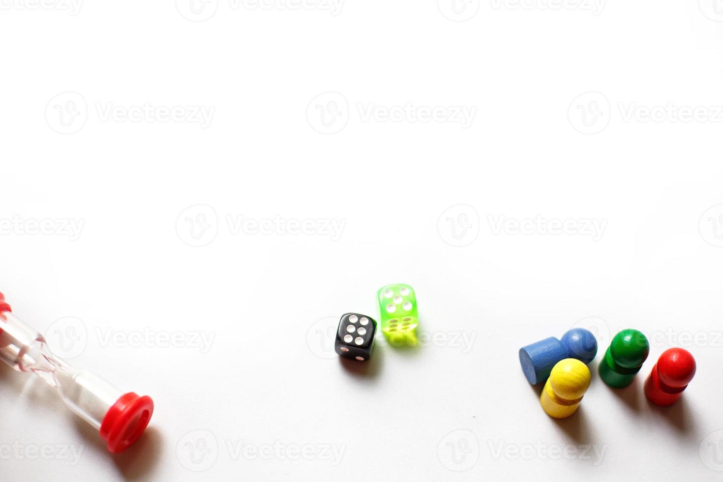 Game cubes, chips, hourglass on a white background. T photo