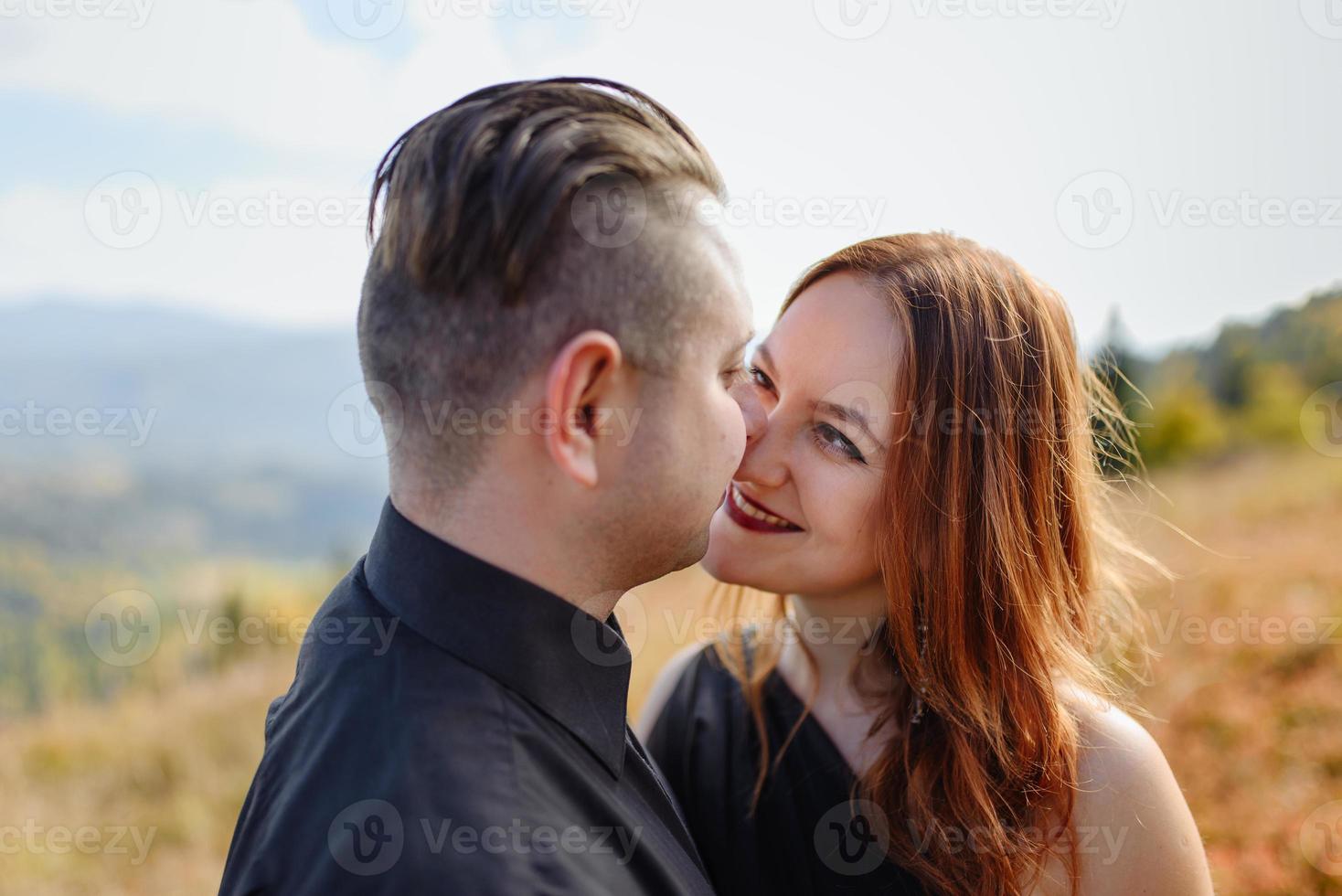 Wedding couple on a background of autumn mountains. photo