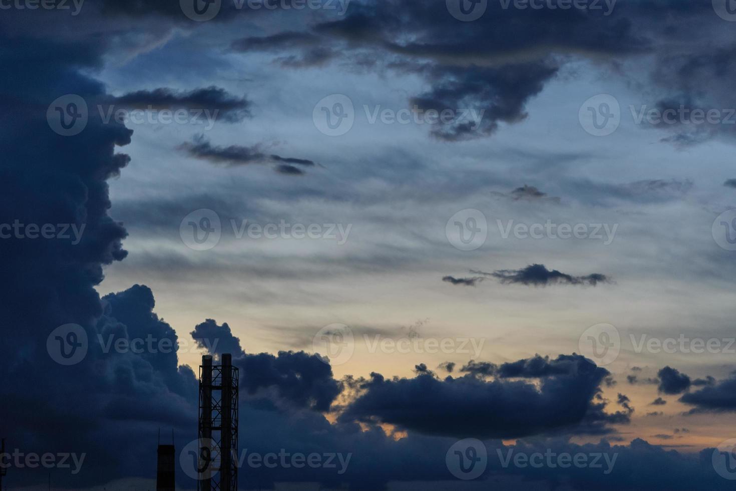 Dark blue storm clouds over city in rainy season photo
