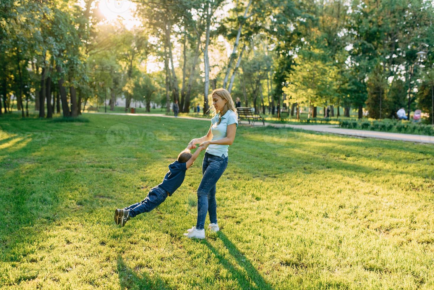 Mom play in the park with their son photo