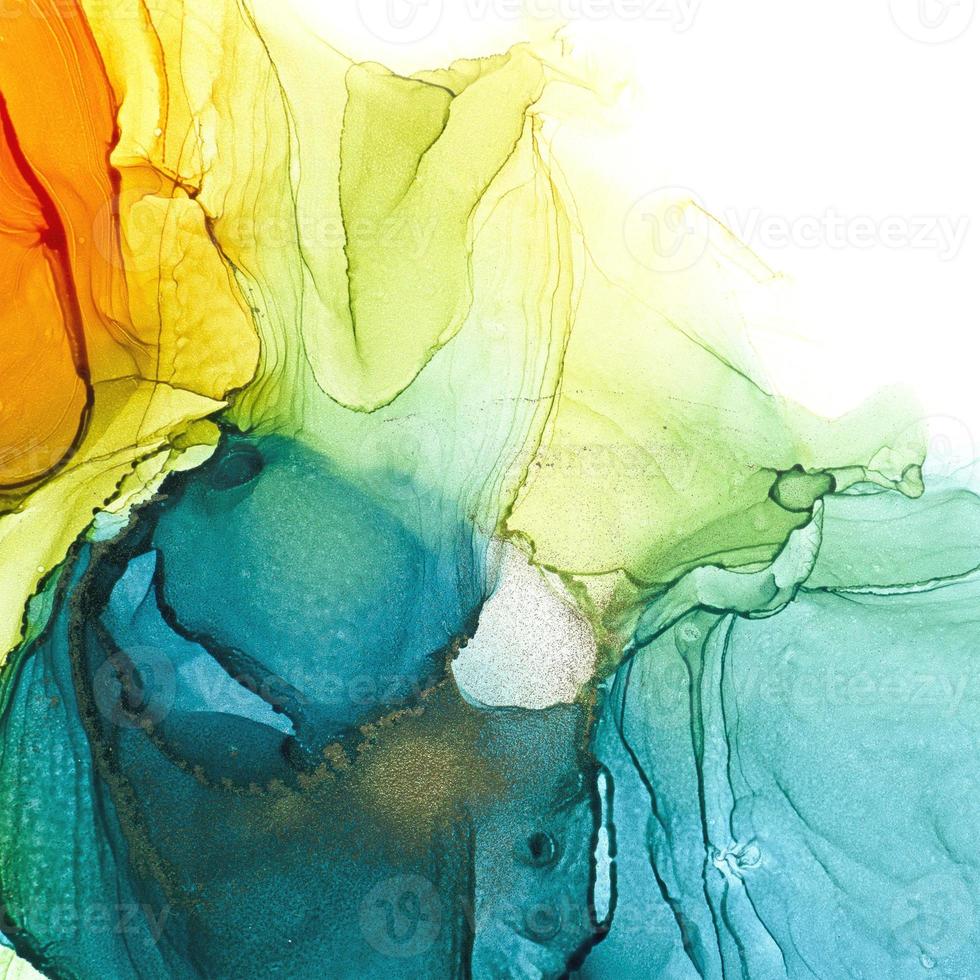 Alcohol ink air texture. Azure, blue, yellow, orange abstract background with golden glitters. Abstract translucent flow. Modern fluid art design photo