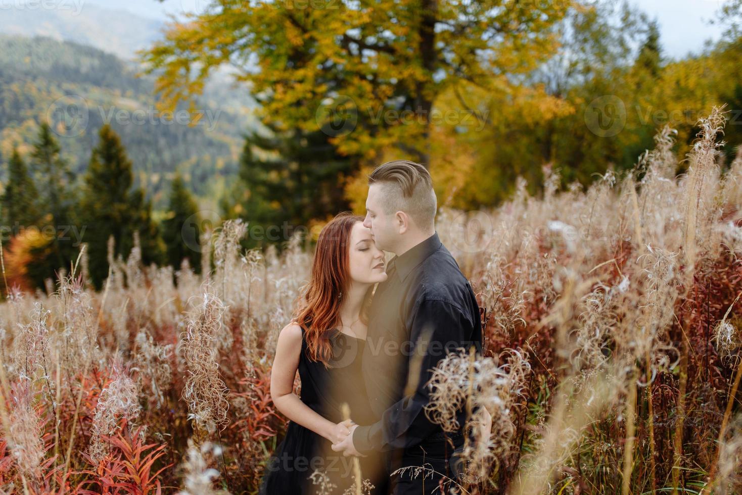 Wedding couple on a background of autumn mountains. photo